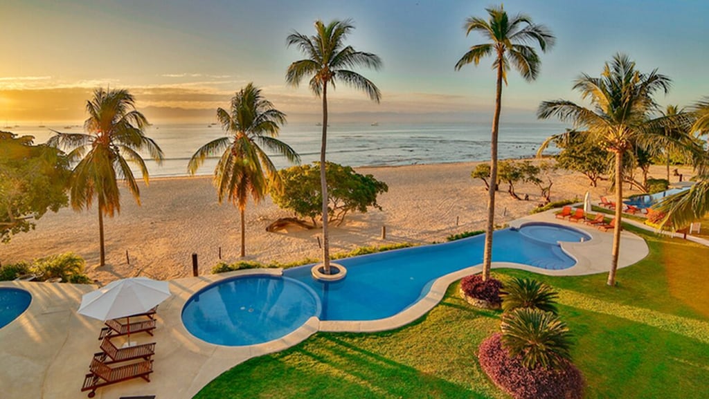 VIEW from Grand Patio to Pool and Beach below